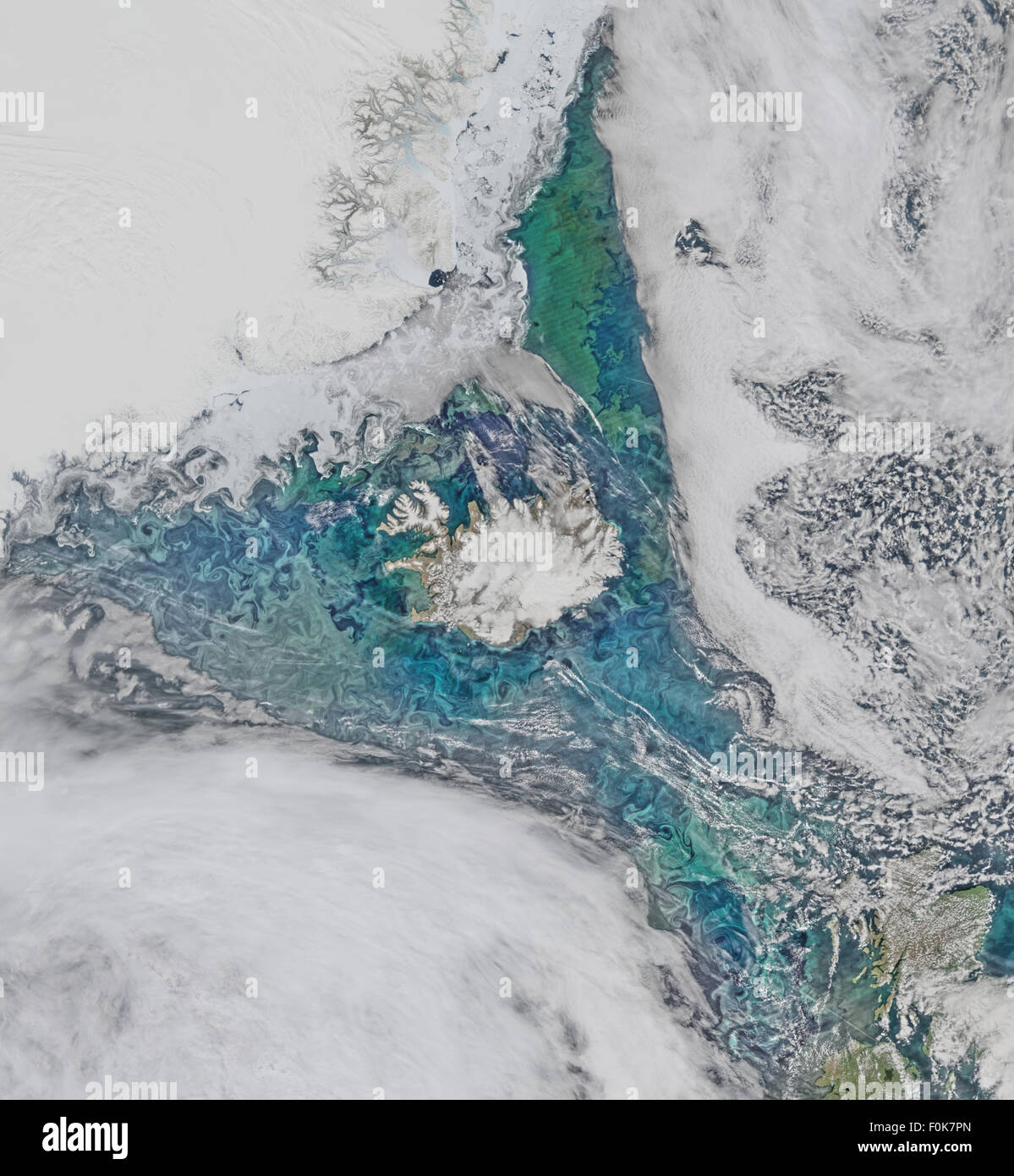 Phytoplankton communities and sea ice limn the turbulent flow field around Iceland in this Suomi-NPP/VIIRS scene collected on June 14, 2015. Stock Photo