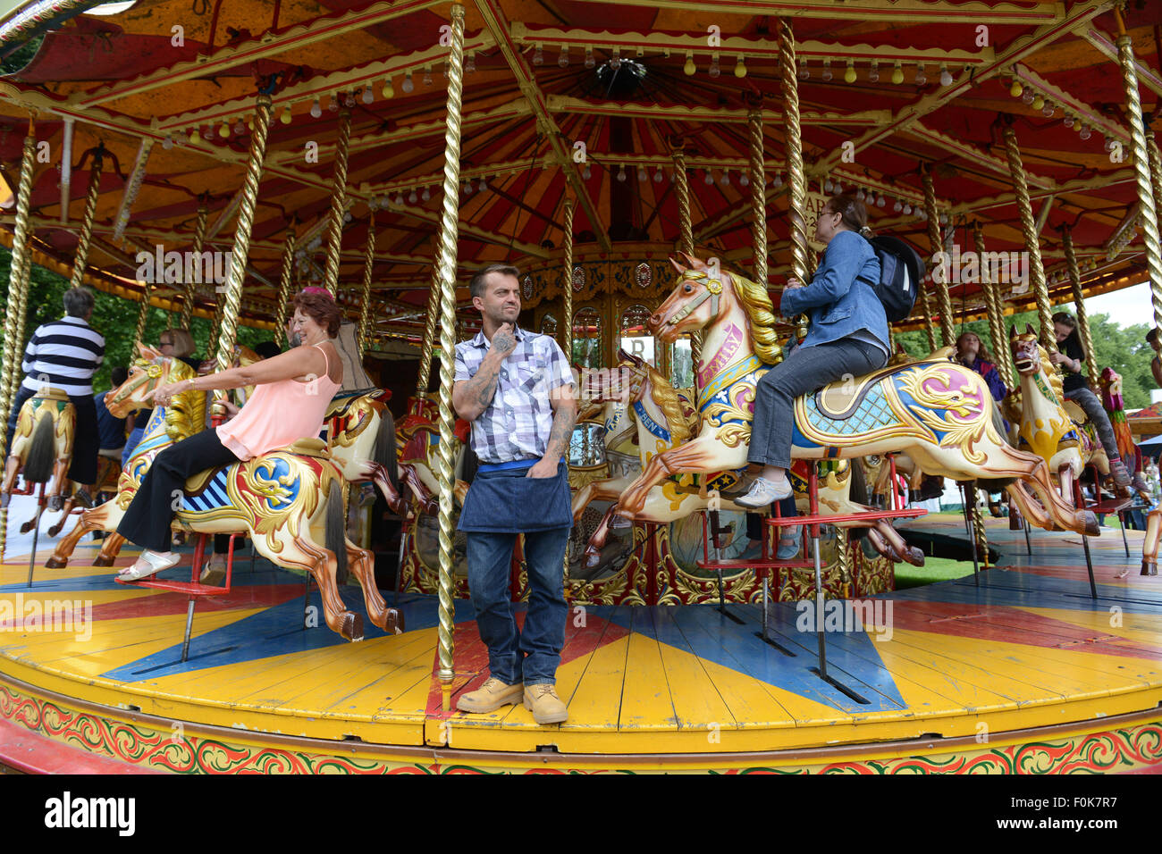 Traditional British merry go round fairground carousel ride Stock Photo