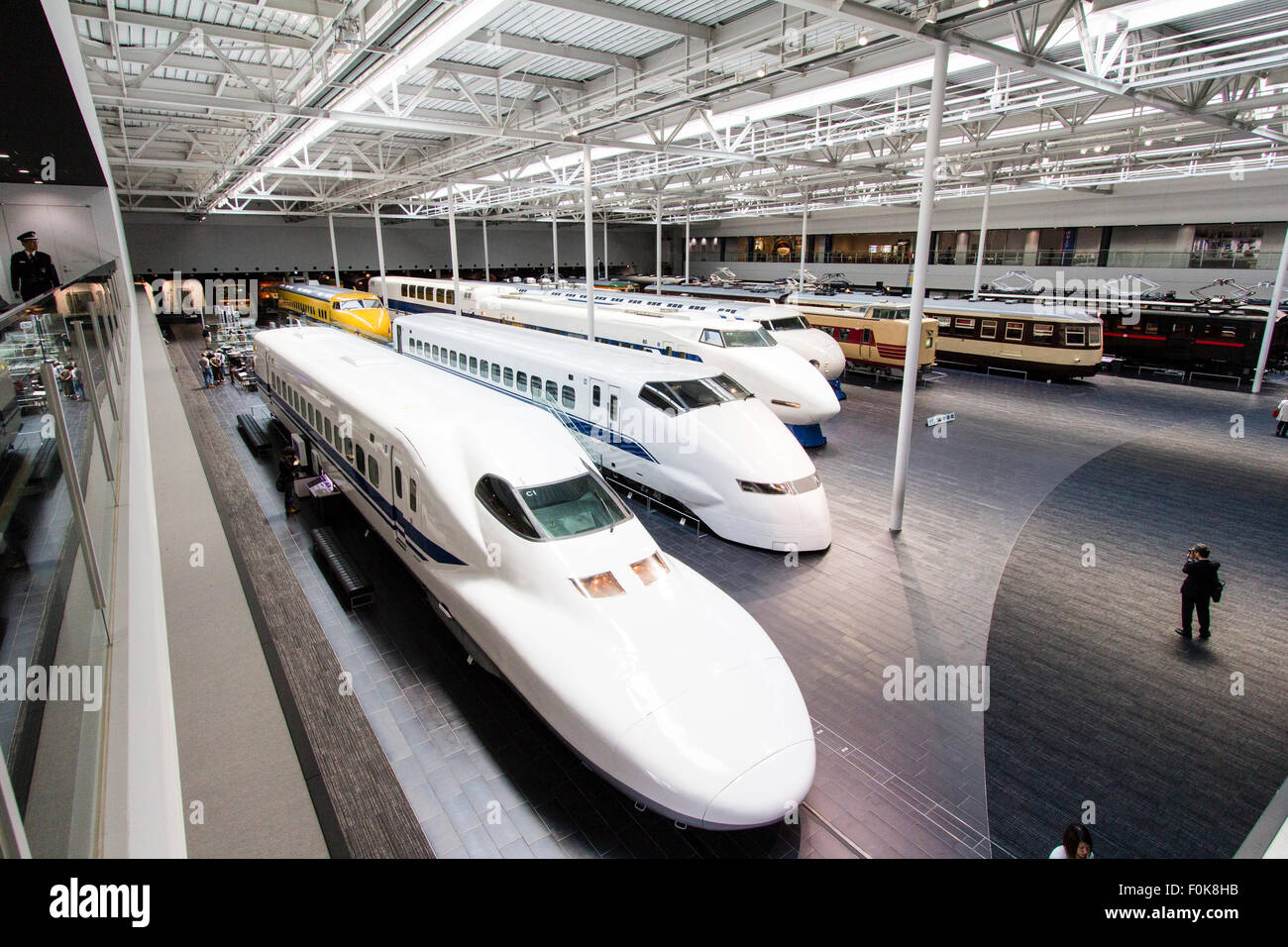 Japan, Nagoya, Railway park. Interior of the Shinkansen Museum. Four bullet trains, 700 series nearest, then 200, 100 and 0 arranged in a line. Stock Photo