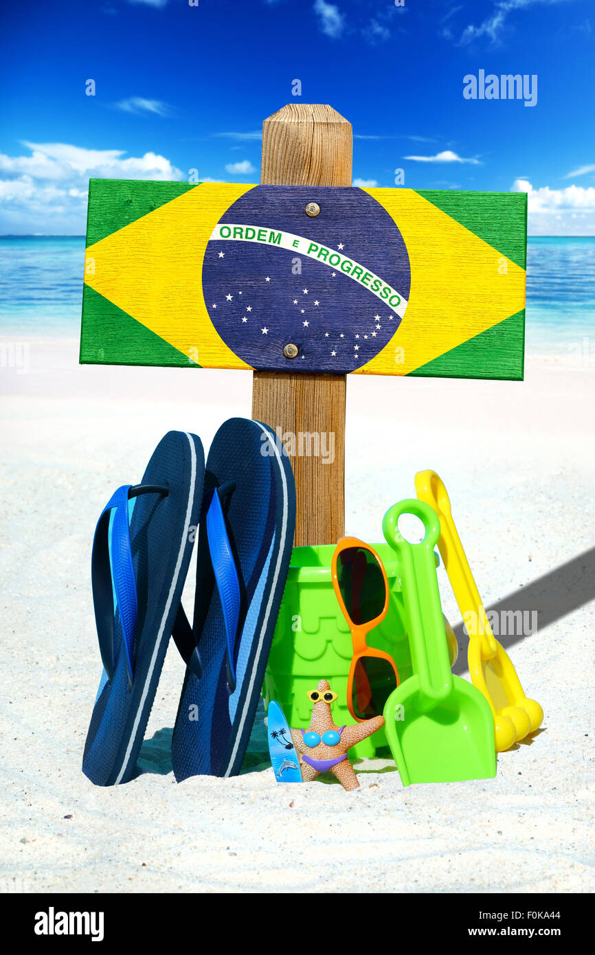 Wooden signboard with the Brazil flag, blue flip flops and colorful