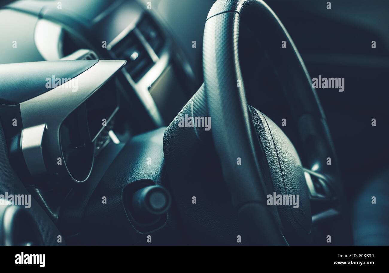 Car Steering Wheel and the Modern Car Interior. Modern Transportation. Stock Photo