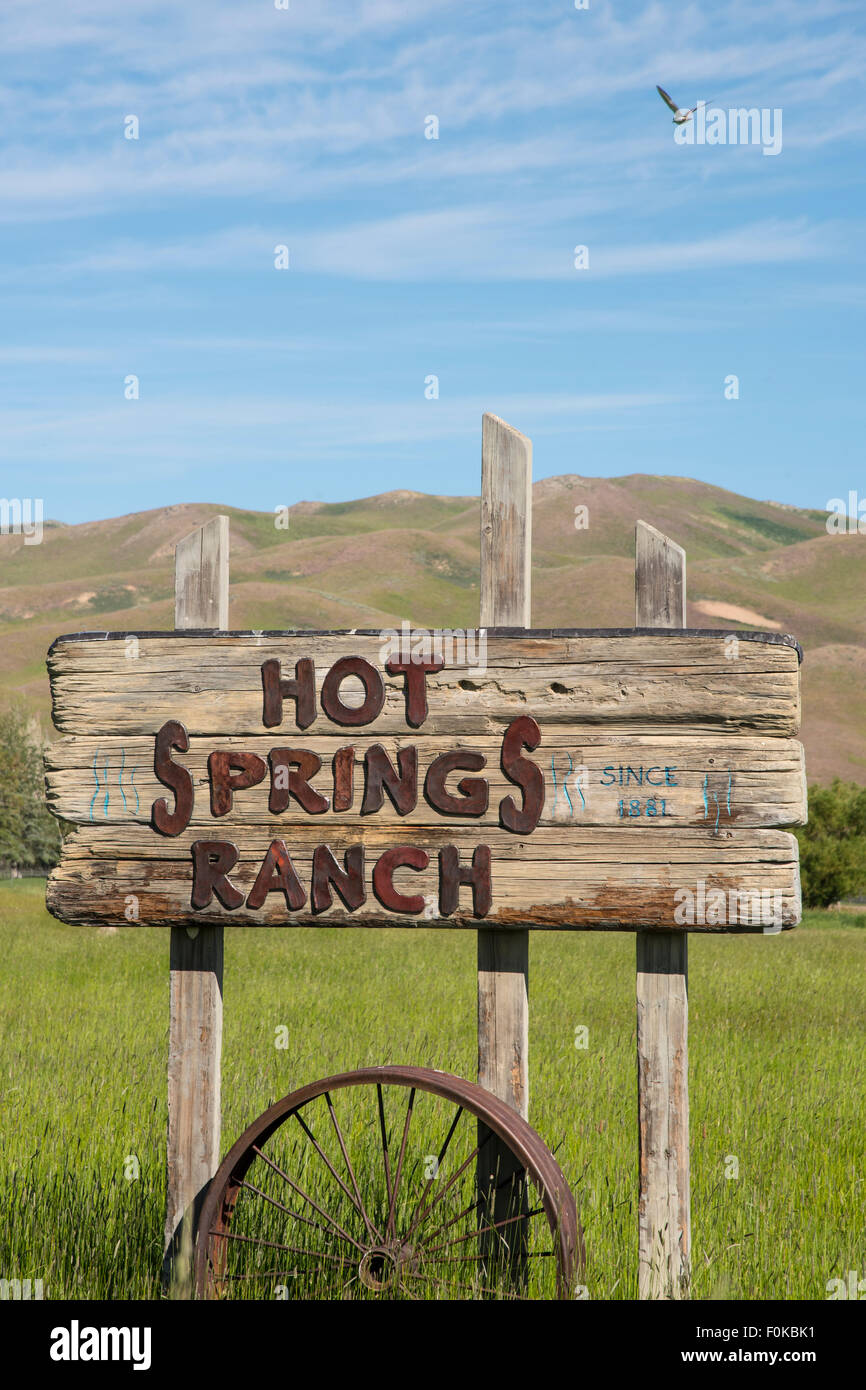 Hot Spring Ranch, Red Barn and Horses Grazing near Soldier-Smokey Mountains Camas-Fairfield area, Idaho, USA Stock Photo