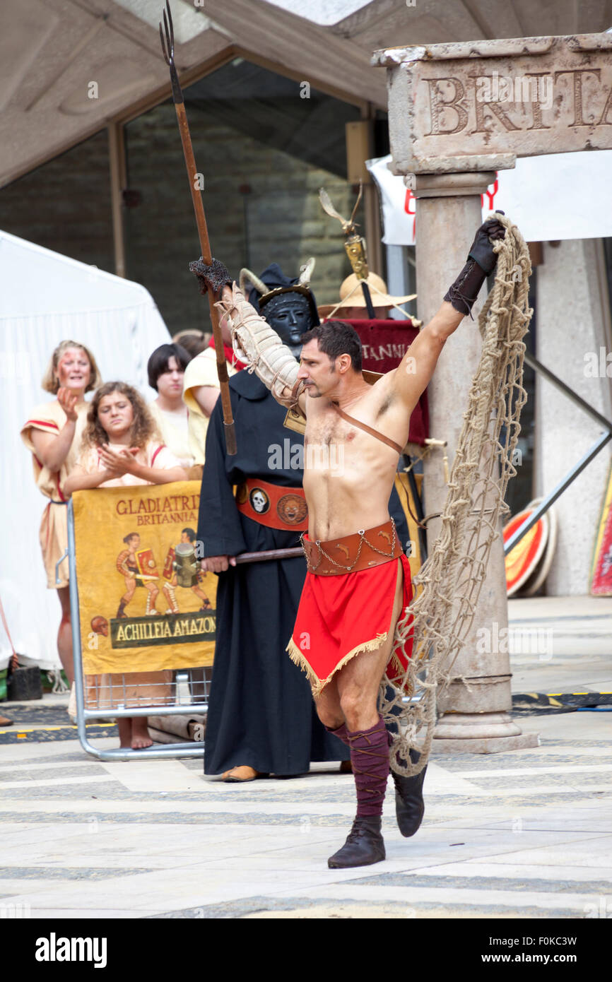 London, UK. 16th August, 2015. Live action Gladiator show at the Guildhall Yard. Professional gladiators battle it out in Guildhall Yard, the site of London's only Roman amphitheatre. The reconstructions of the gladiator-style games once held in ancient Londinium took place before an emperor and cheerful crowd who decide which warrior will get to walk free based on their performance. Credit: Nathaniel Noir/Alamy Live News Stock Photo