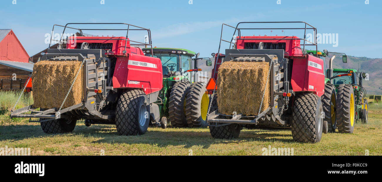 Agriculture, Farm Machinery, Big Tractors and Bailers parked at Rice Farms ready for harvest. Camas Prairie-Fairfield, Idaho,USA Stock Photo