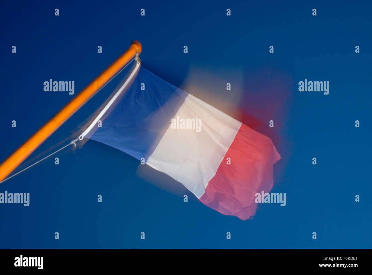 Flag of France flying in the wind, blurred Stock Photo