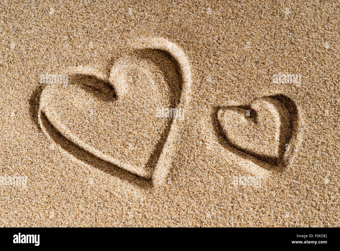 A heart painted in the sand Stock Photo