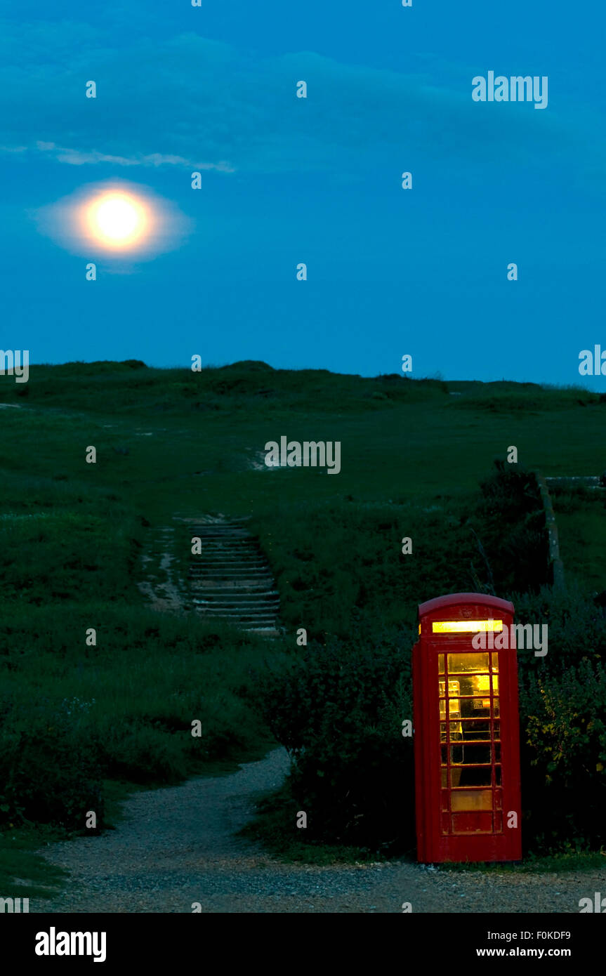 telephone box and full moon in south england, great britain, europe Stock Photo