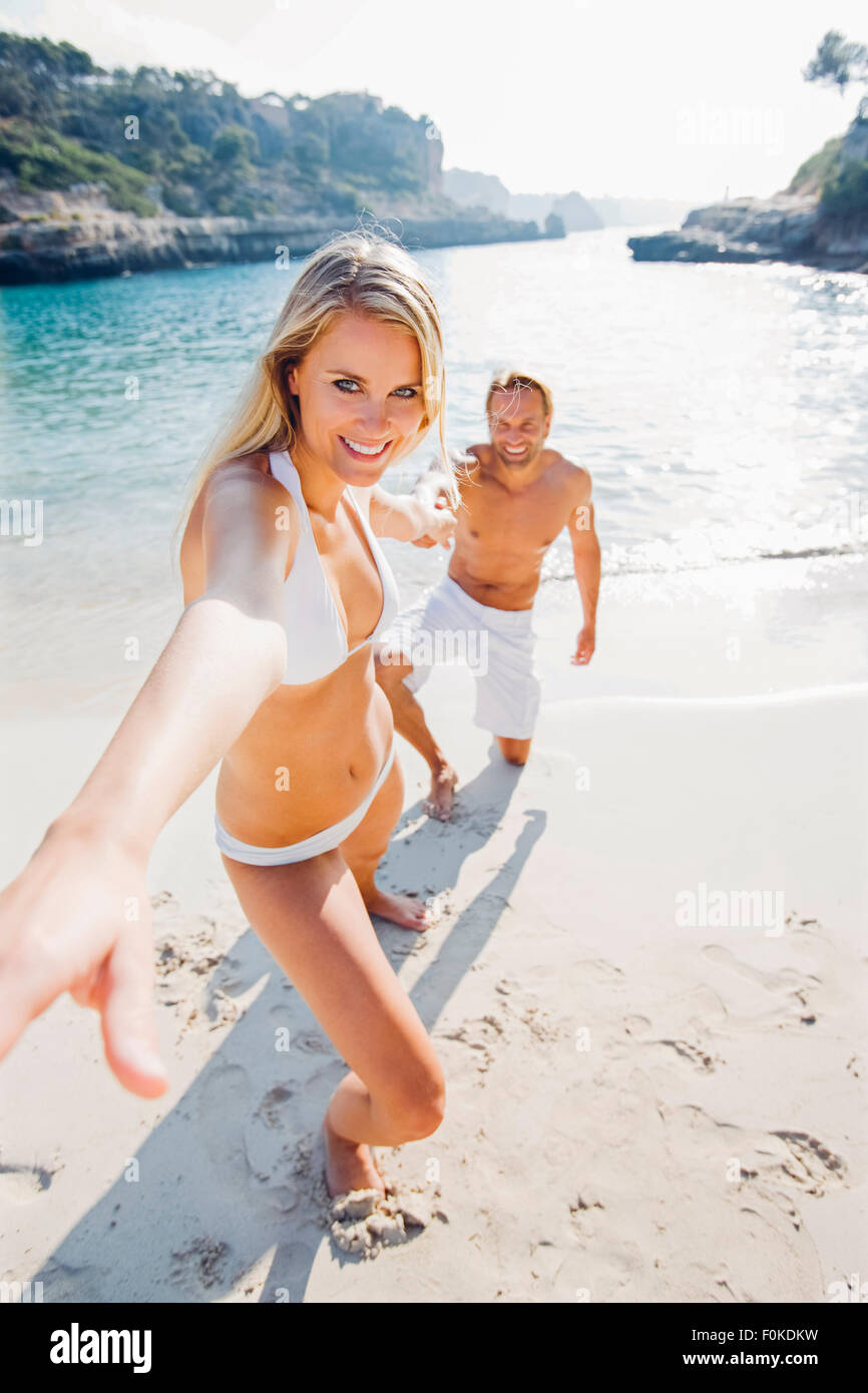 Pulling her bikini hi-res stock photography and images - Alamy
