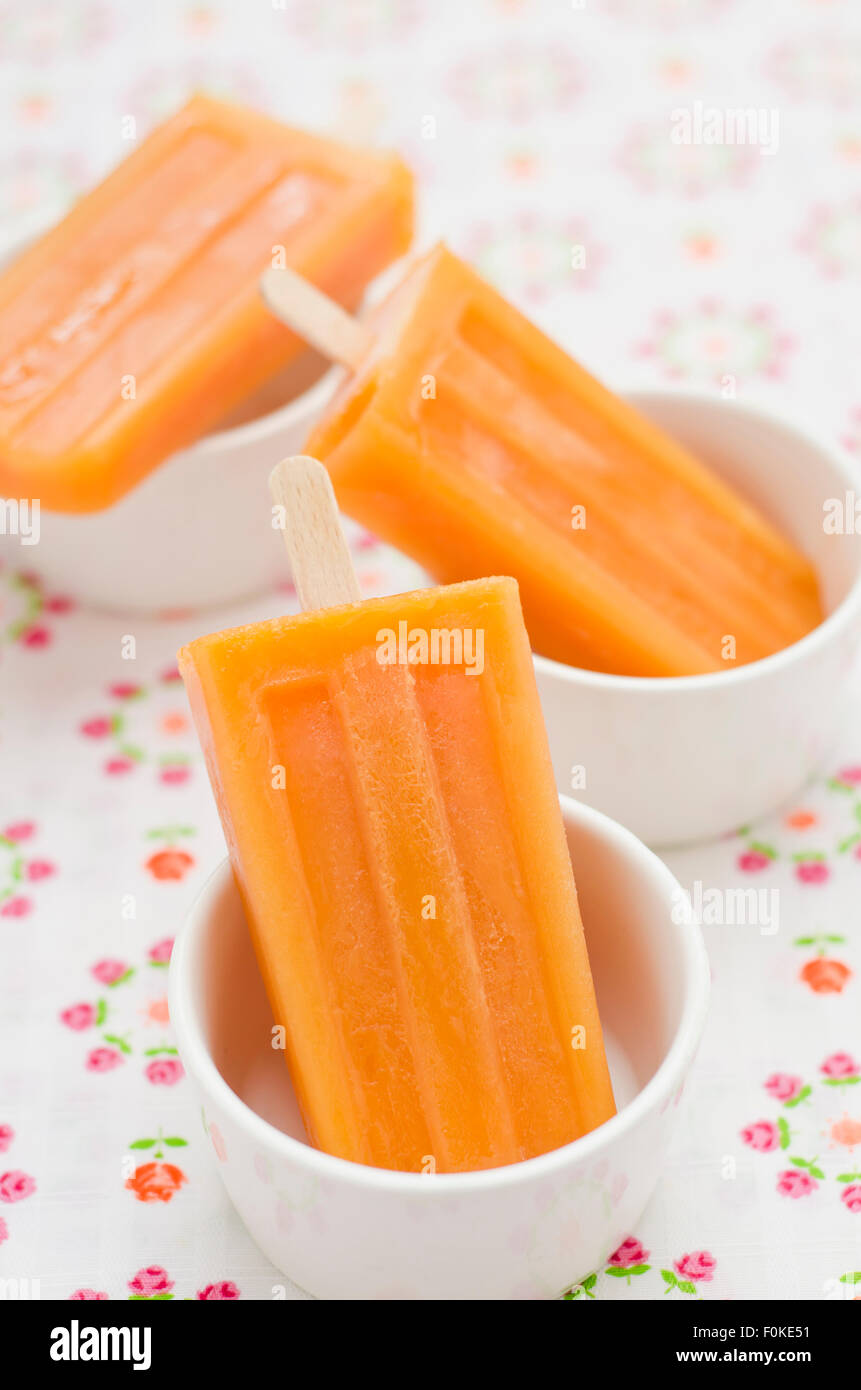 Three bowls with fruit juice ice lollies Stock Photo Alamy