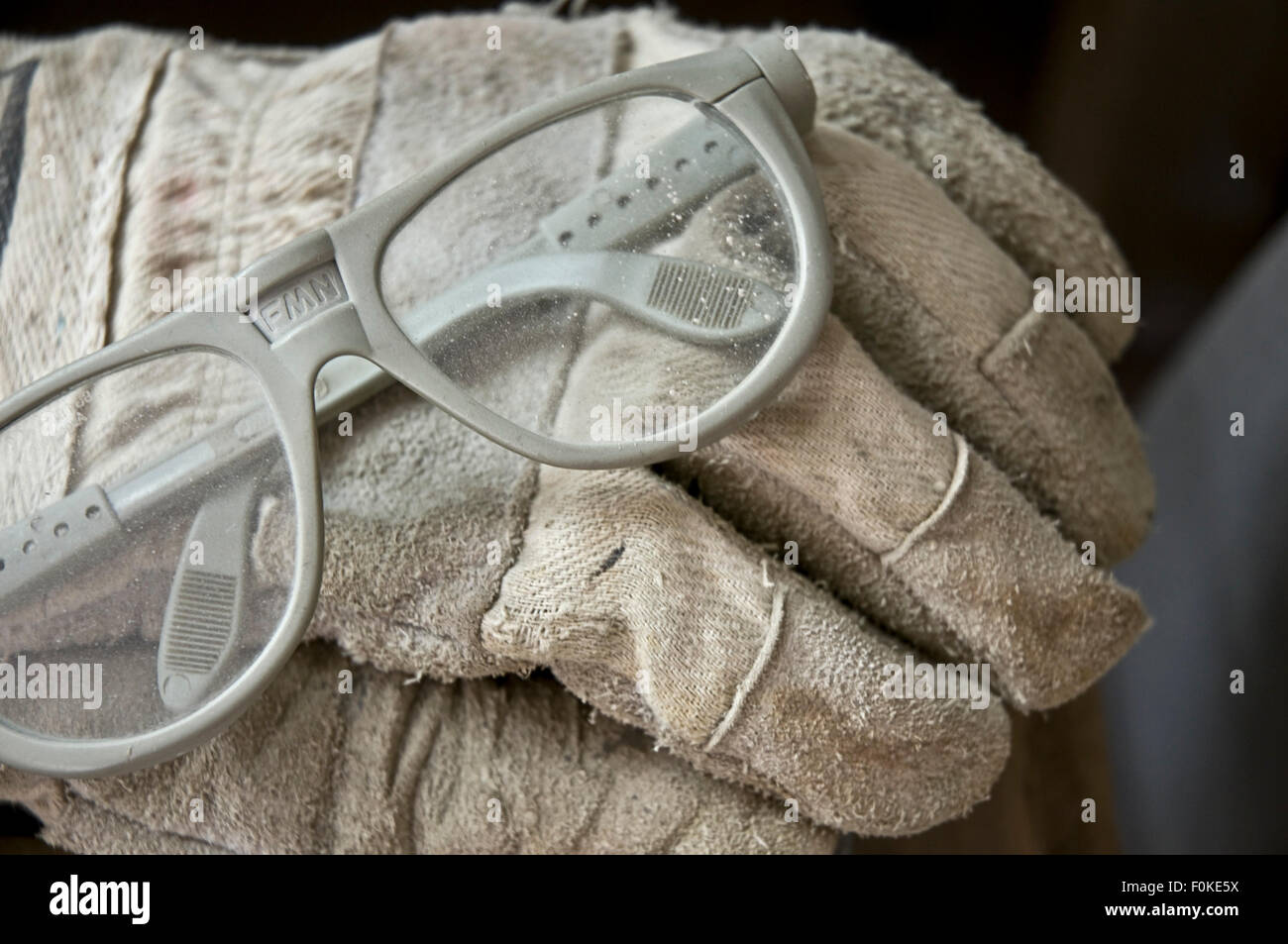 Safety glasses and work gloves of a stonemason Germany Stock Photo