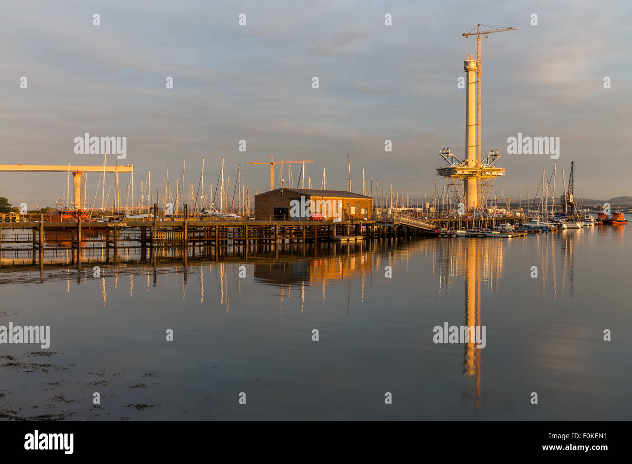 Reflections at sunrise on Port Edgar Marina in South Queensferry, Scotland UK with the Queensferry Crossing under construction Stock Photo