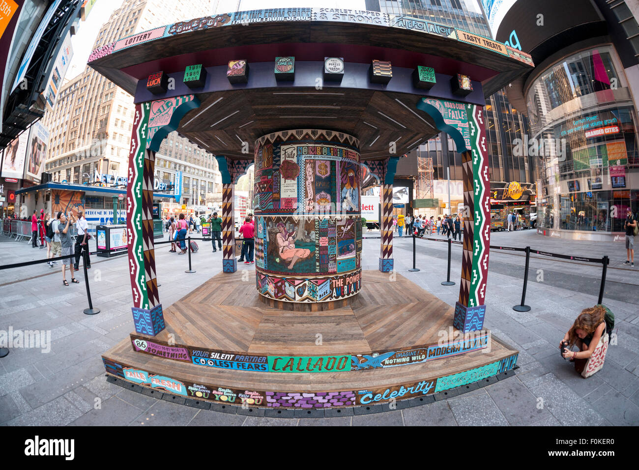 'FAILE: Wishing on You' debuts in Times Square in New York on Monday, August 17, 2015. The installation which reimagines Asian prayer wheels using designs inspired by Times Square history is by the artist collaboration FAILE, Patrick McNeil and Patrick Miller. The public sculpture will be on display until September 1 and runs concurrent with FAILE's exhibition at the Brooklyn Museum. (© Richard B. Levine) Stock Photo