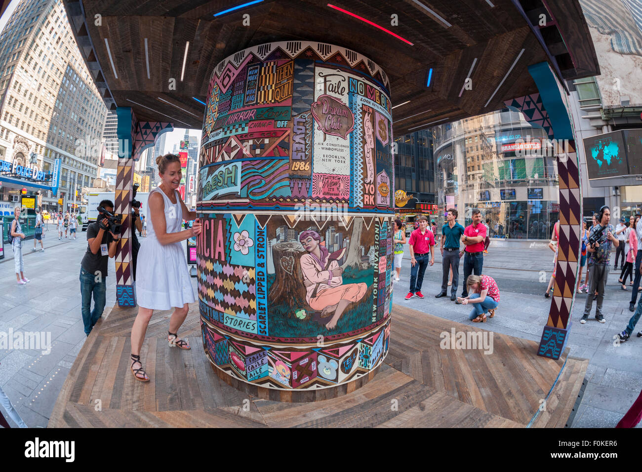 'FAILE: Wishing on You' debuts in Times Square in New York on Monday, August 17, 2015. The installation which reimagines Asian prayer wheels using designs inspired by Times Square history is by the artist collaboration FAILE, Patrick McNeil and Patrick Miller. The public sculpture will be on display until September 1 and runs concurrent with FAILE's exhibition at the Brooklyn Museum. (© Richard B. Levine) Stock Photo