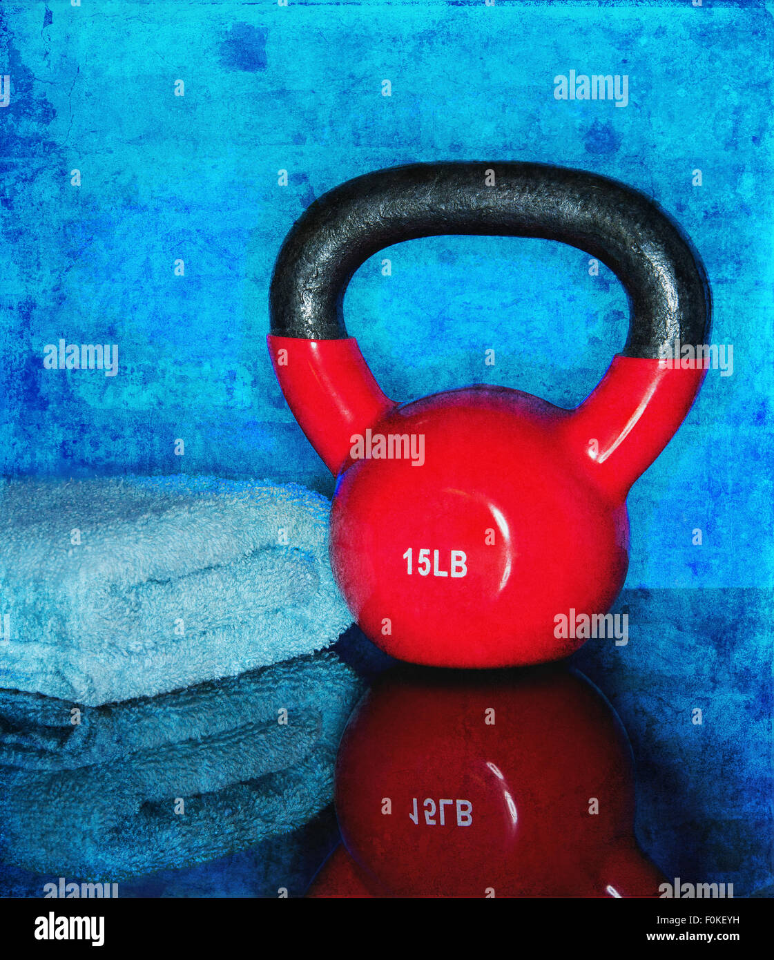 Red Kettle ball on blue background with towel Stock Photo