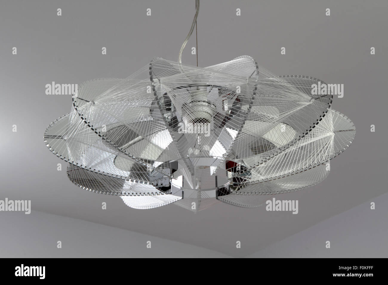 Intricate modern ceiling lamp shade Stock Photo Alamy