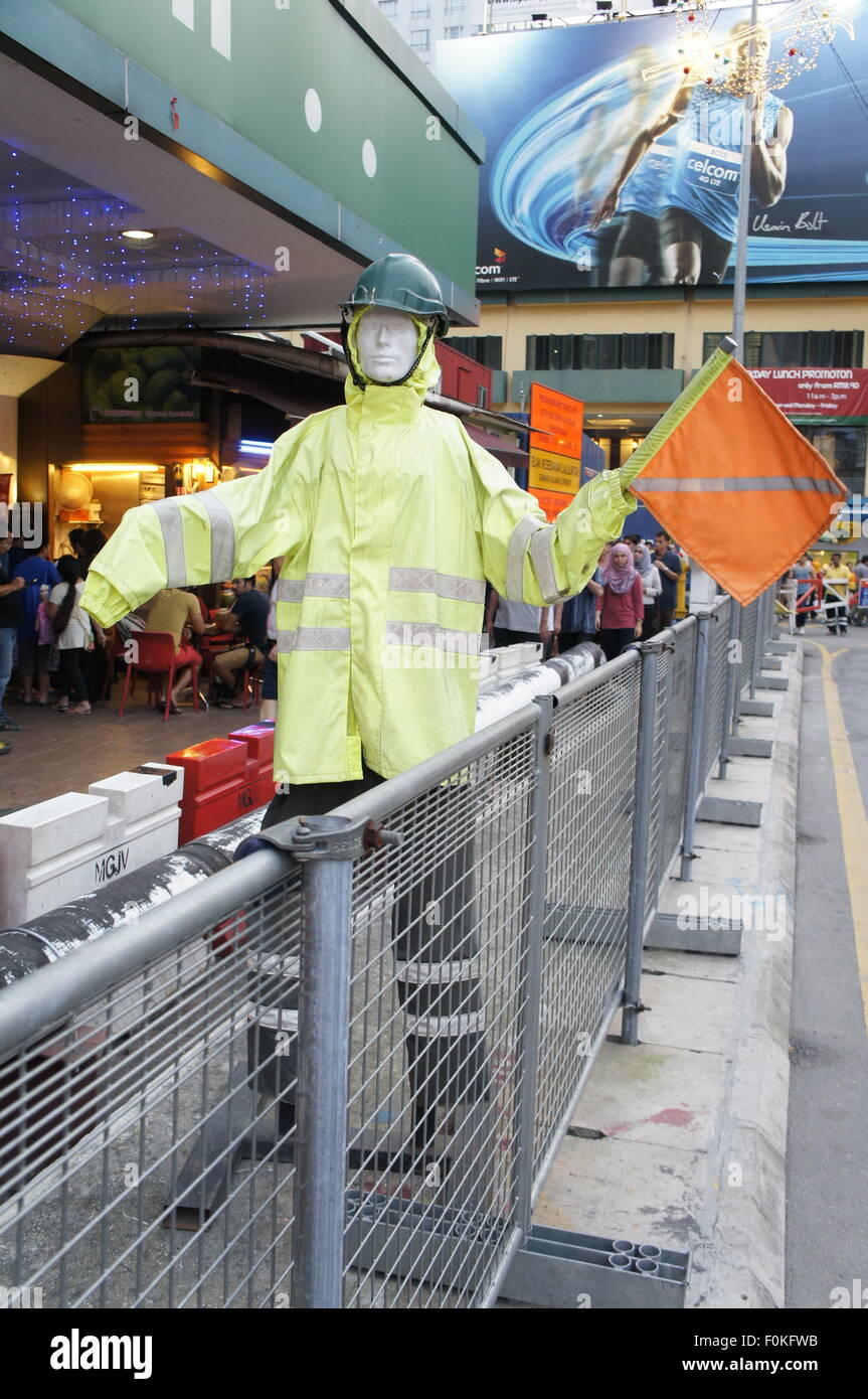traffic guard mannequin directing traffic Stock Photo