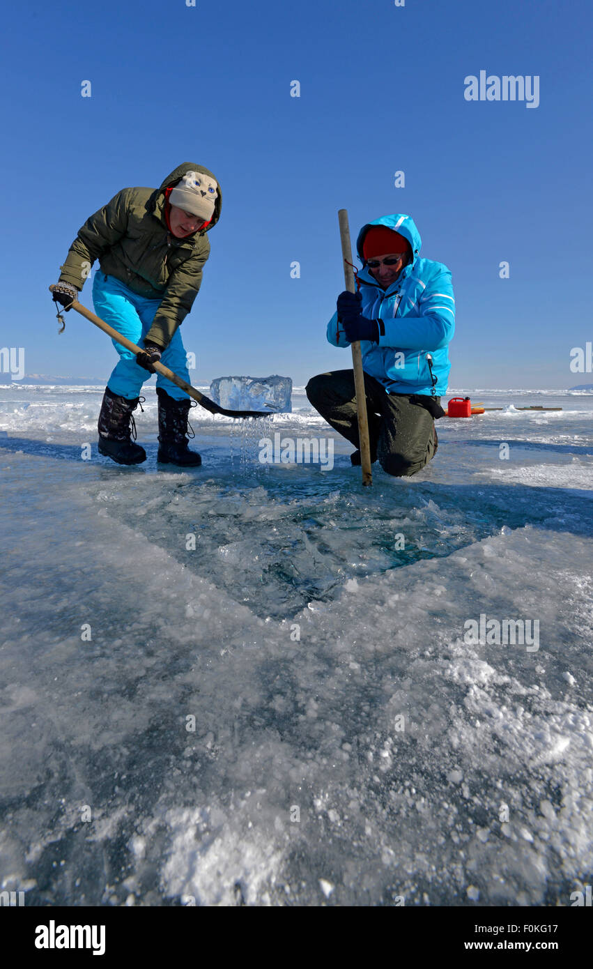 Russia, Lake Baikal, preparation of an ice hole  for ice diving Stock Photo