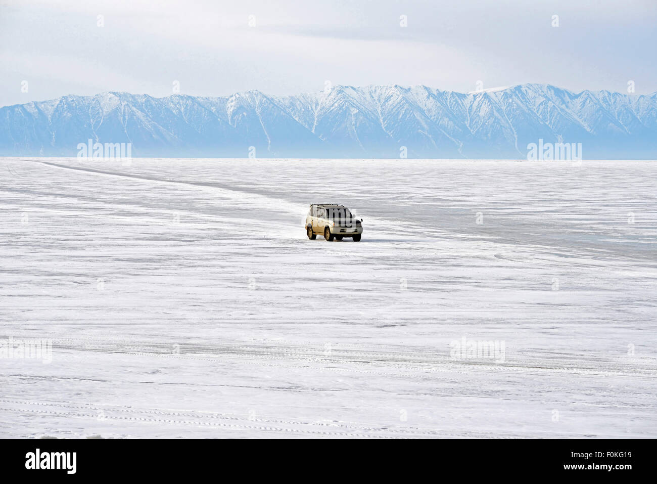 Russia, Lake Baikal, pickup truck driving on frozen lake Stock Photo