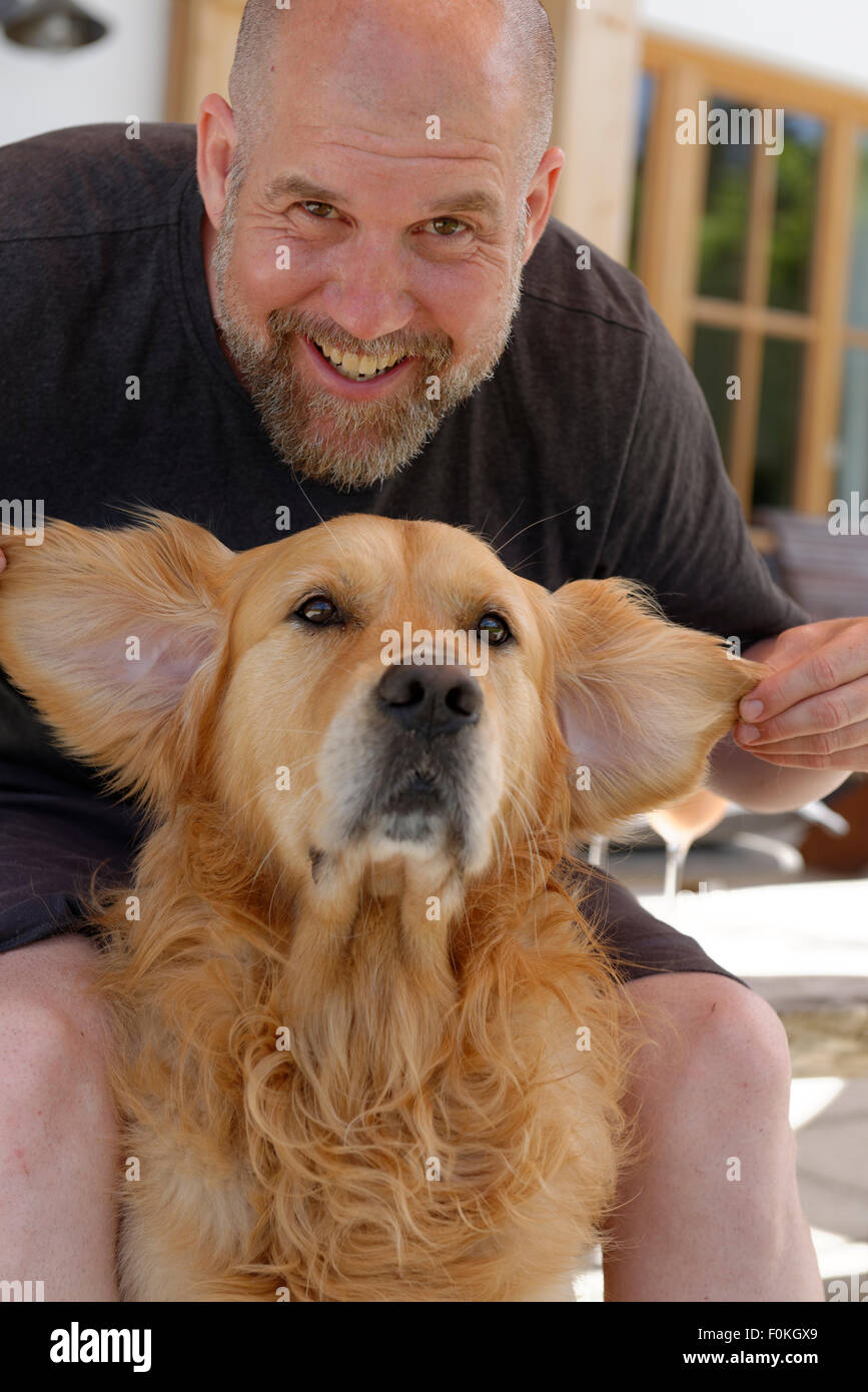 Portrait of man and his Golden Retriever Stock Photo Alamy