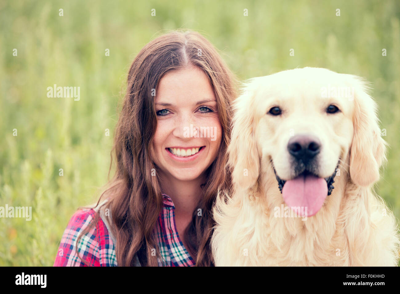 Portrait of woman and her Golden Retriever Stock Photo - Alamy