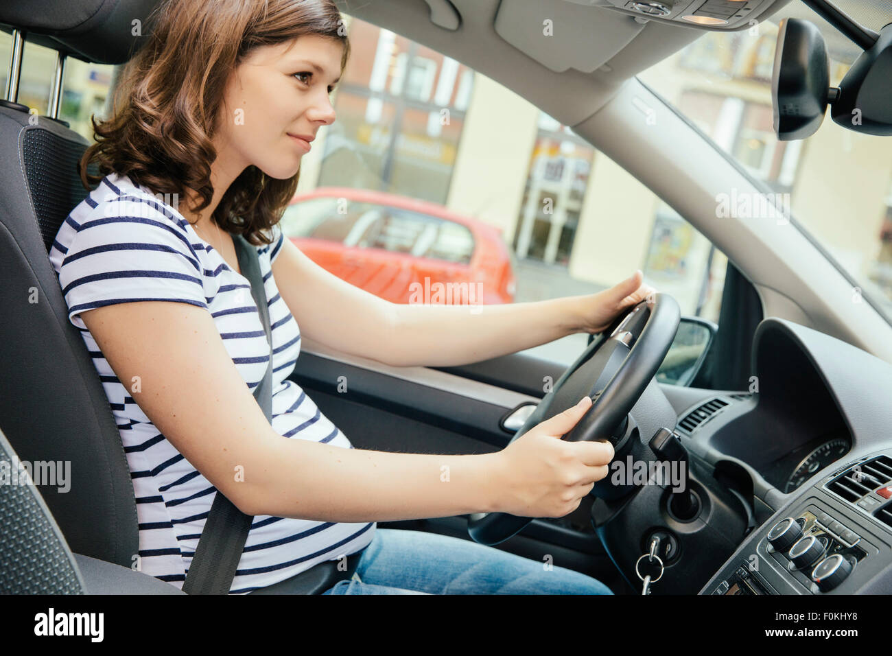 Pregnant woman driving car Stock Photo Alamy