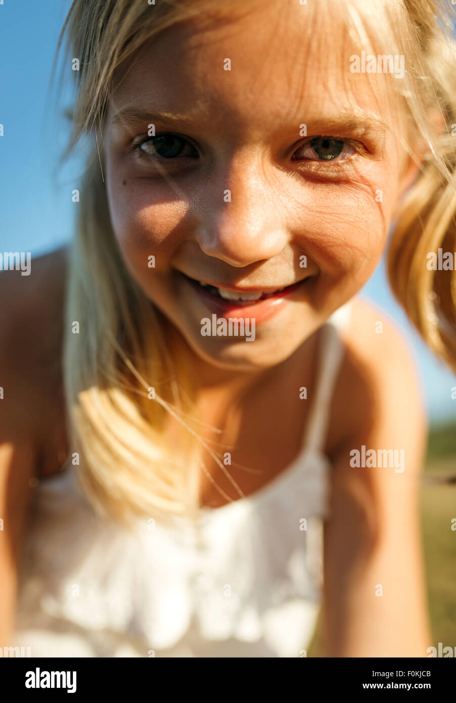 Portrait of smiling blond girl Stock Photo - Alamy