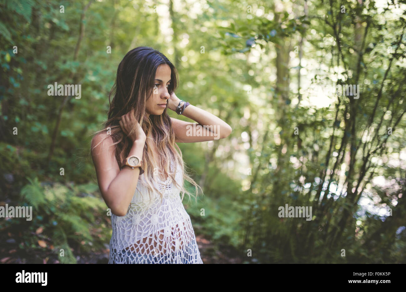 Young woman in the forest Stock Photo - Alamy