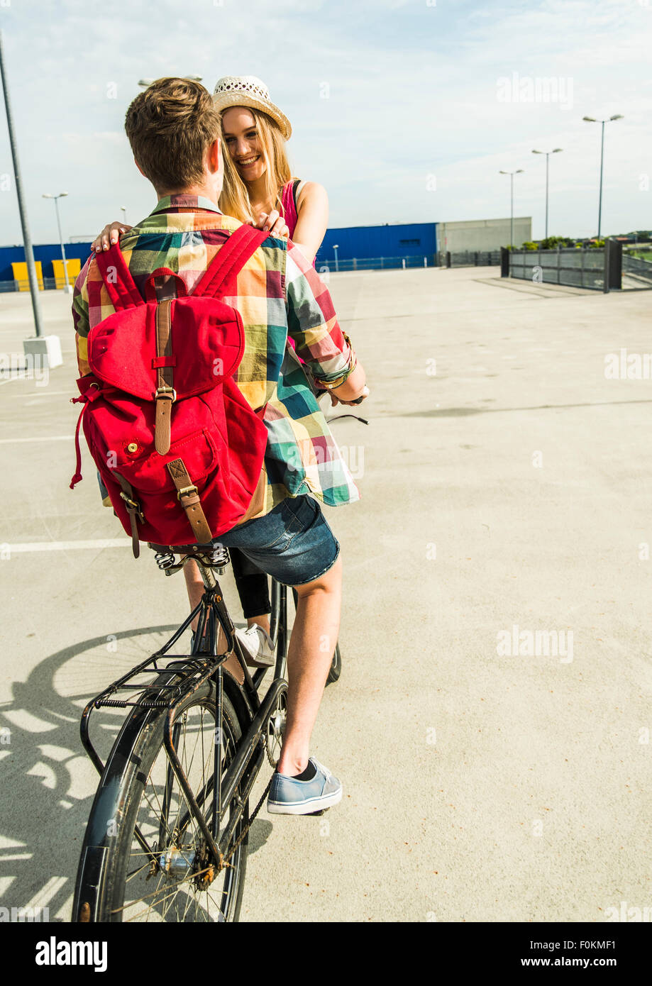 Happy young couple together on a bicycle Stock Photo
