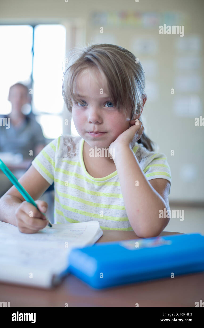 Portrait of primary schoolgirl in classroom Stock Photo - Alamy