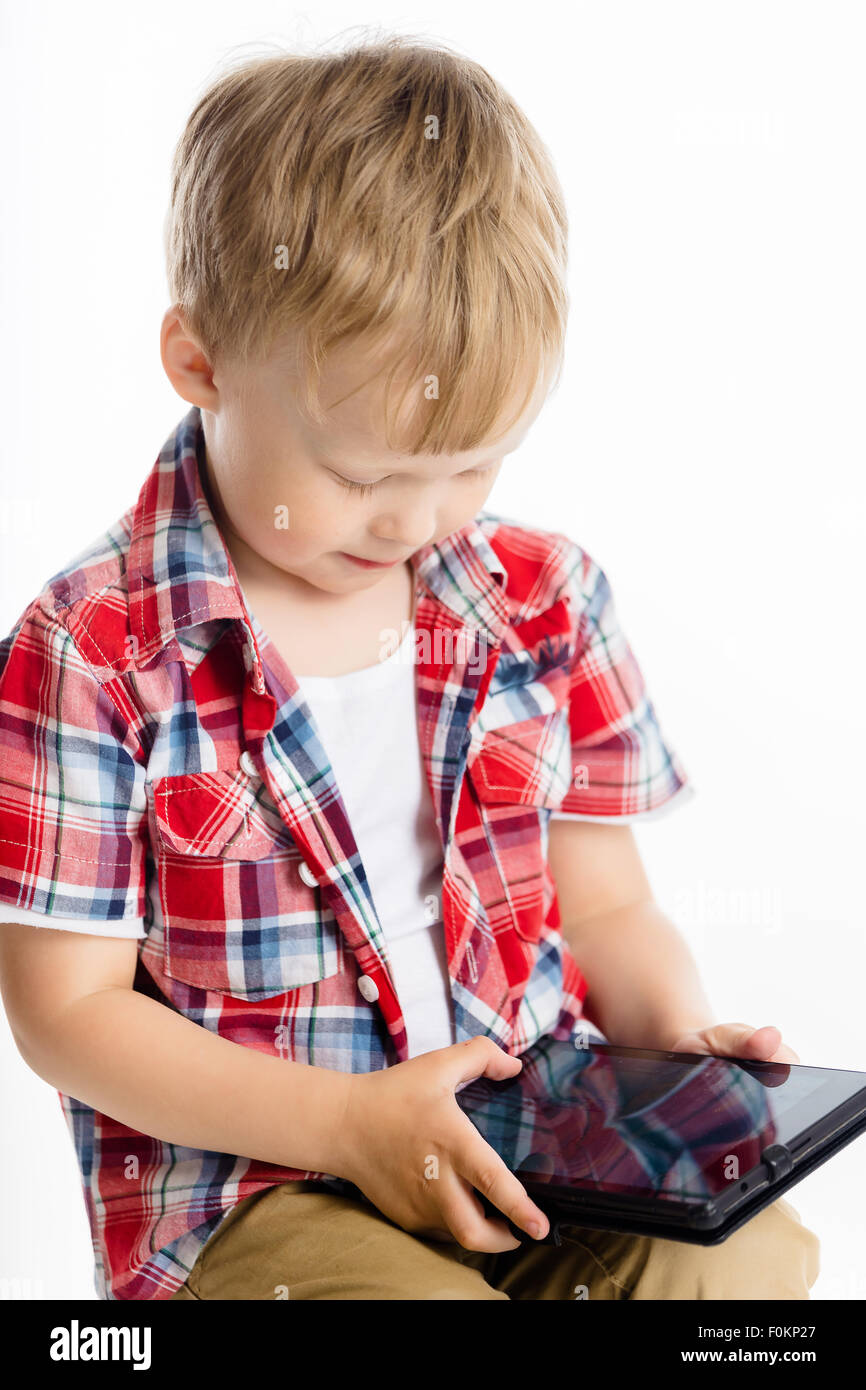 Little boy with a Tablet PC. studio Stock Photo - Alamy