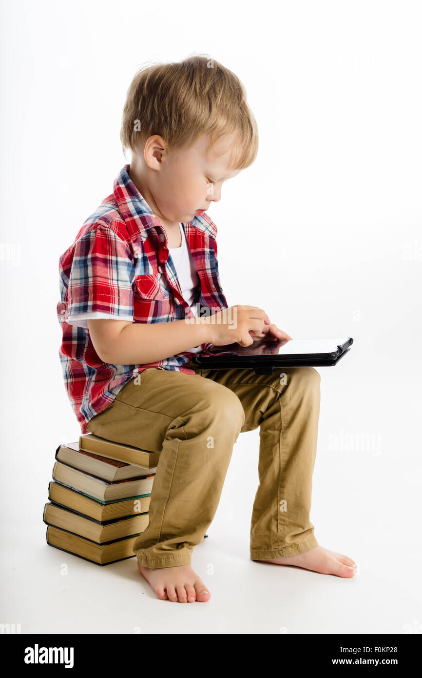 Little boy with a Tablet PC. studio Stock Photo - Alamy