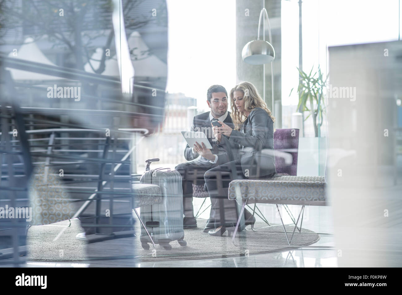 Business people in hotel lobby Stock Photo - Alamy