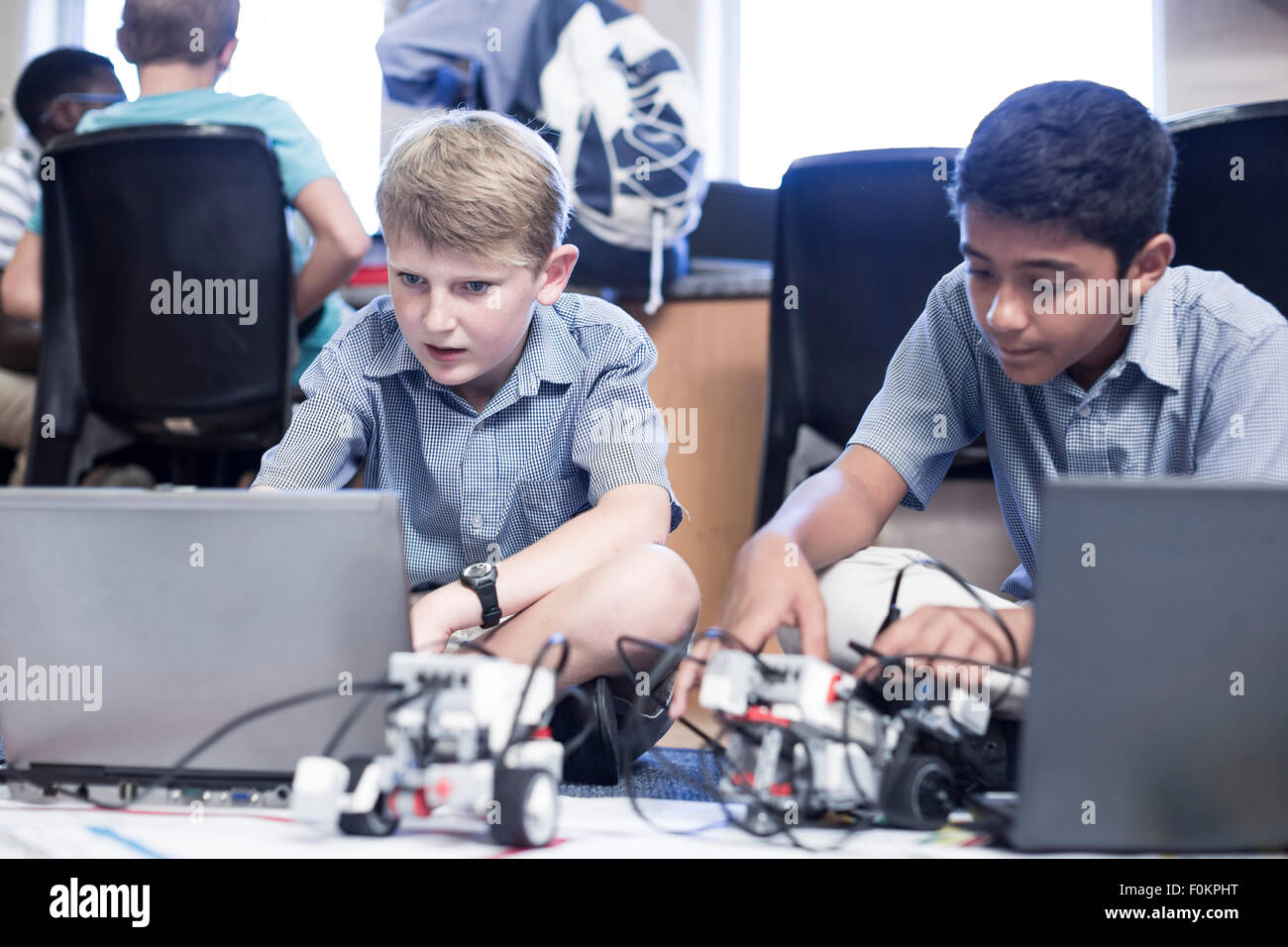 Schoolboys with laptop in robotics class Stock Photo - Alamy