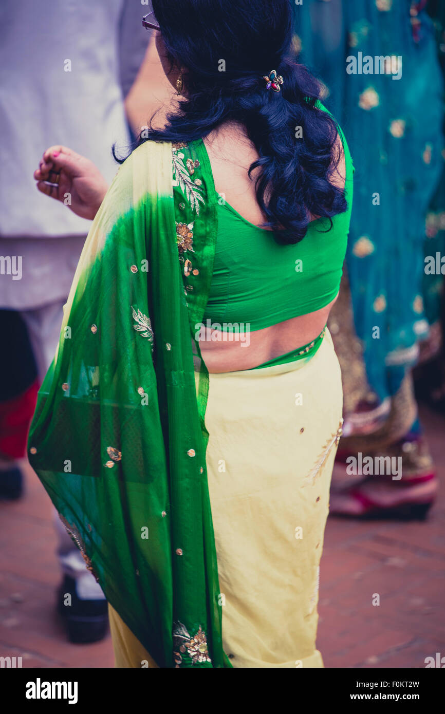 Unrecognizable woman dressed in a green traditional indian dress for a wedding ceremony, Nepal, 2013. Stock Photo