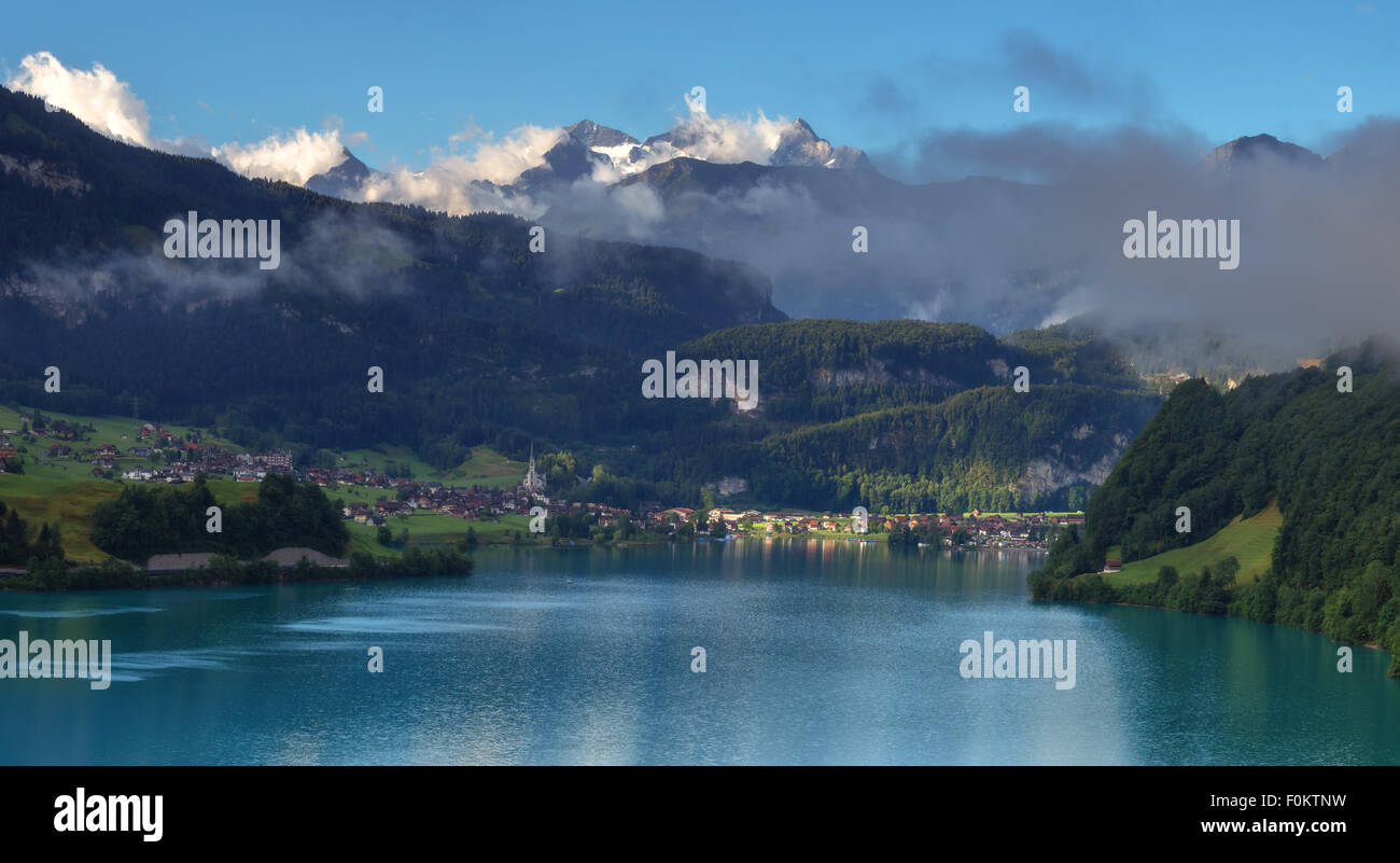 Amazing view of the Lungerersee lake in the morning mist. Lungern village, Switzerland, Europe. Stock Photo