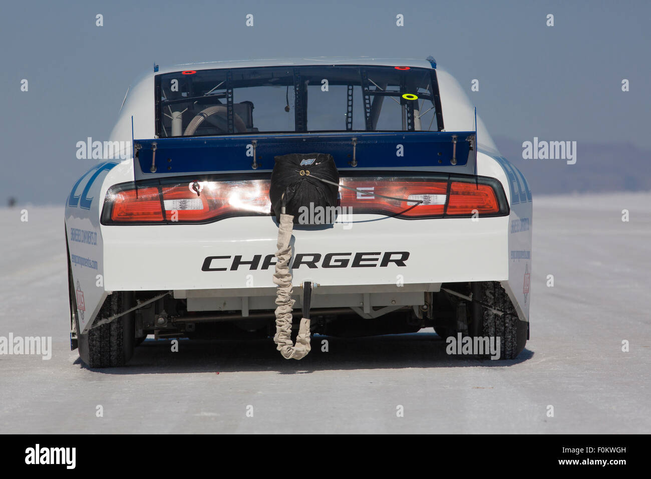 Rear view of a white hot rod racing car on the racing track just before ...
