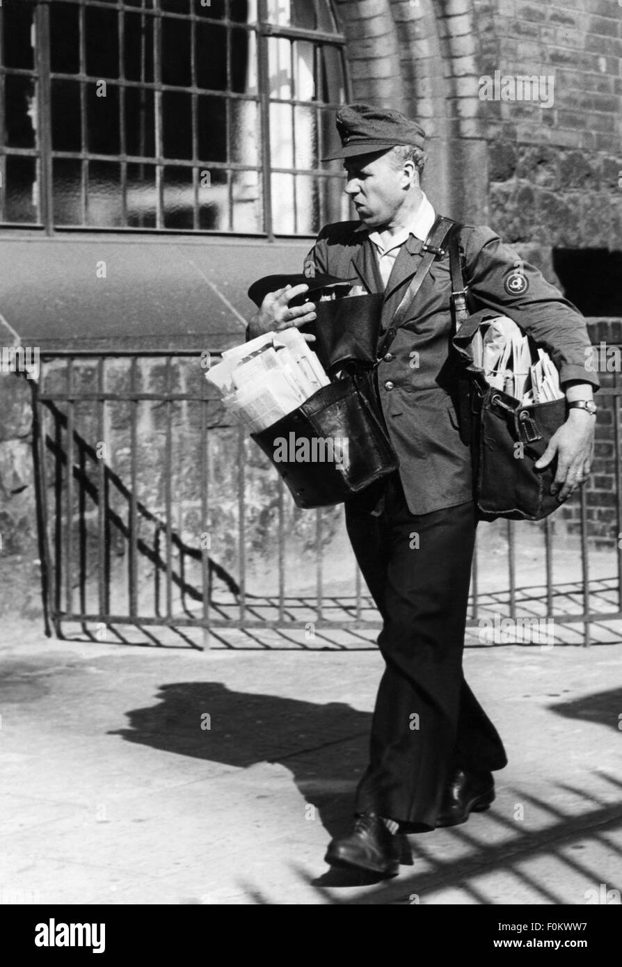 people, professions, postman, postman carrying many bags, 1950s, Additional-Rights-Clearences-Not Available Stock Photo