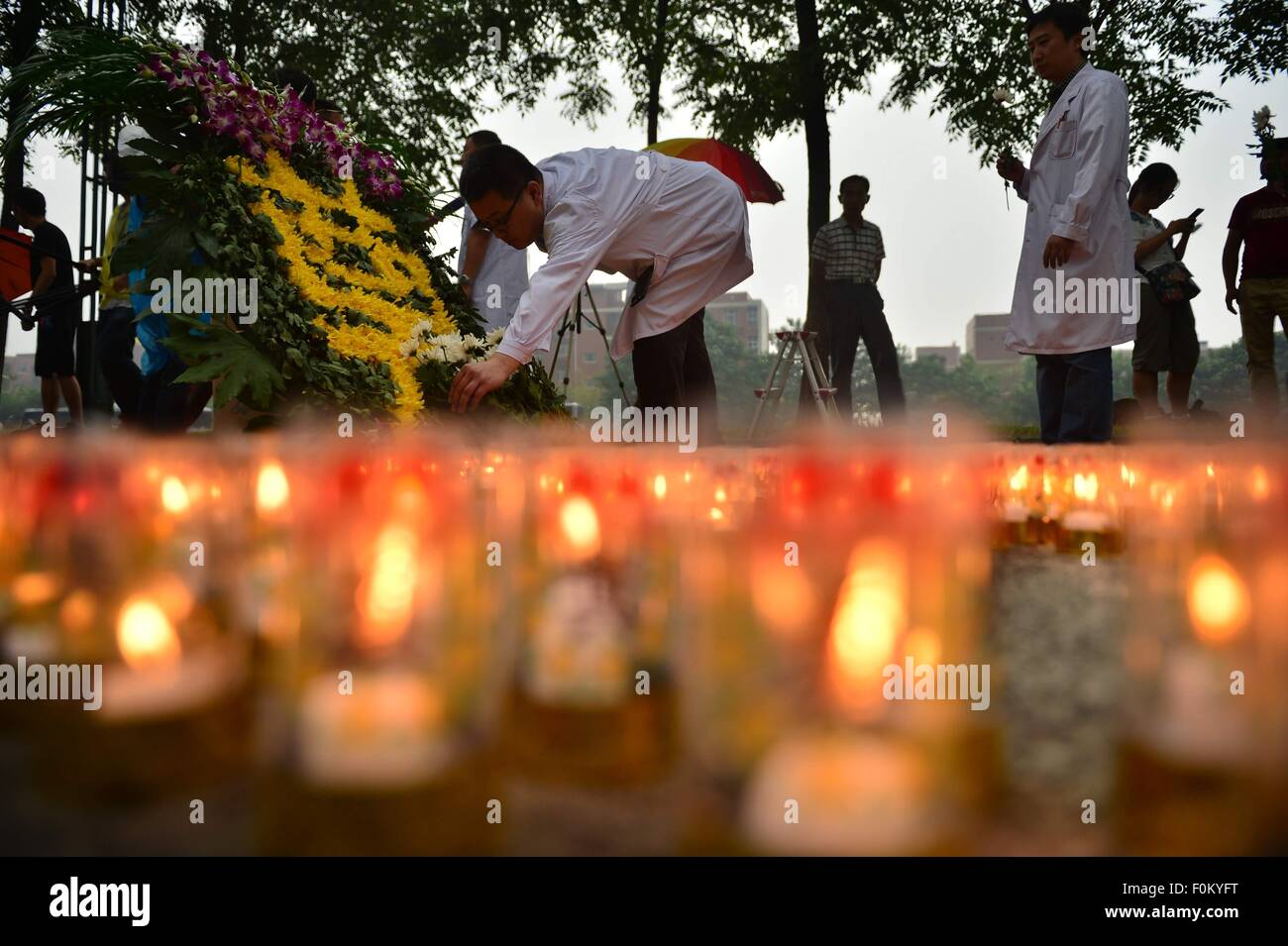 Tianjin, China. 18th Aug, 2015. A mourning ceremony is held for the victims of the massive warehouse explosions at Taida Hospital near the explosion site in Tianjin, north China, Aug. 18, 2015. The death toll from last week's massive blasts in Tianjin rose to 114. Credit:  You Sixing/Xinhua/Alamy Live News Stock Photo