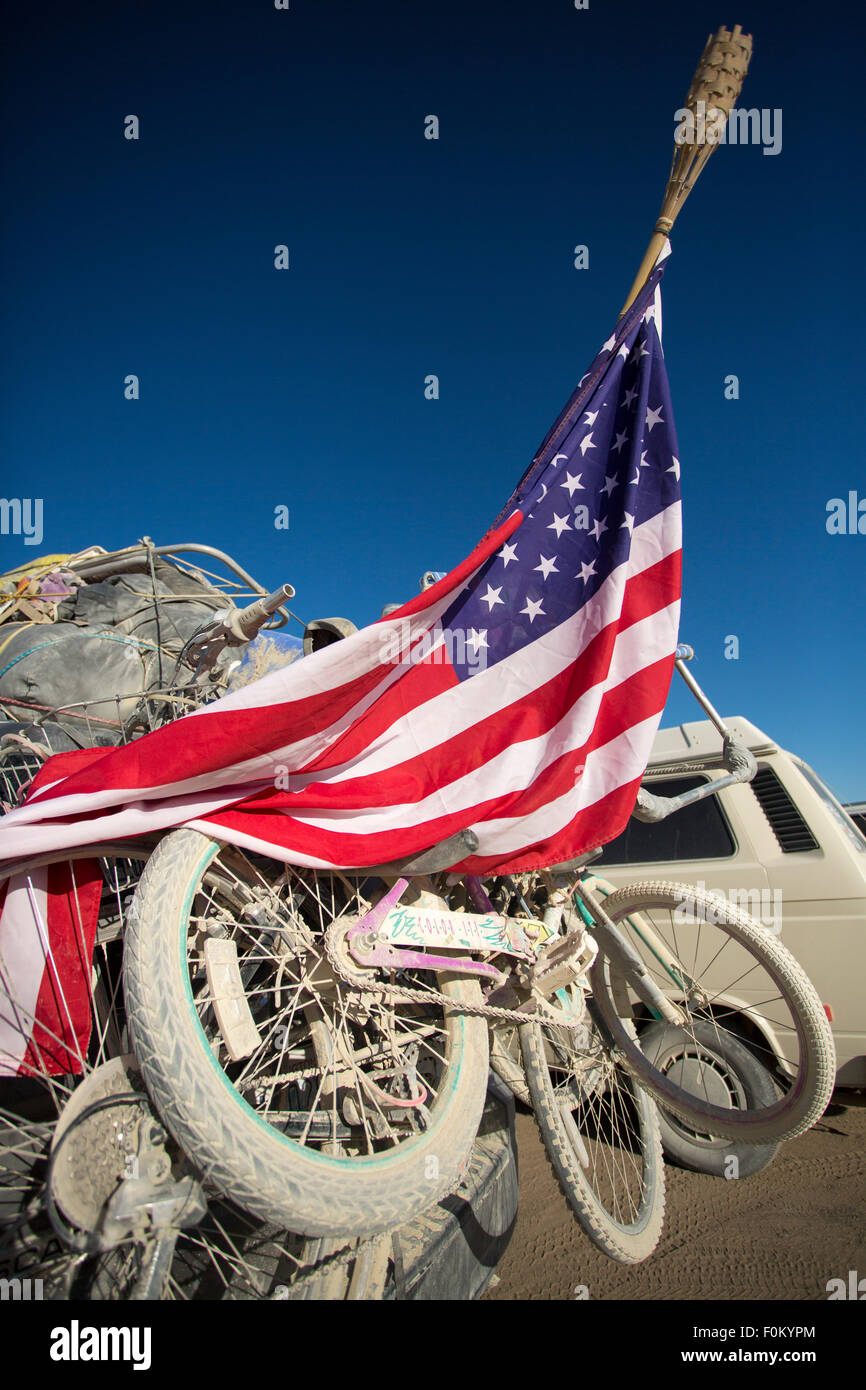 Mountain bikes on a car rack taken at the exit of the Burning Man festival in 2012 with US flags Stock Photo