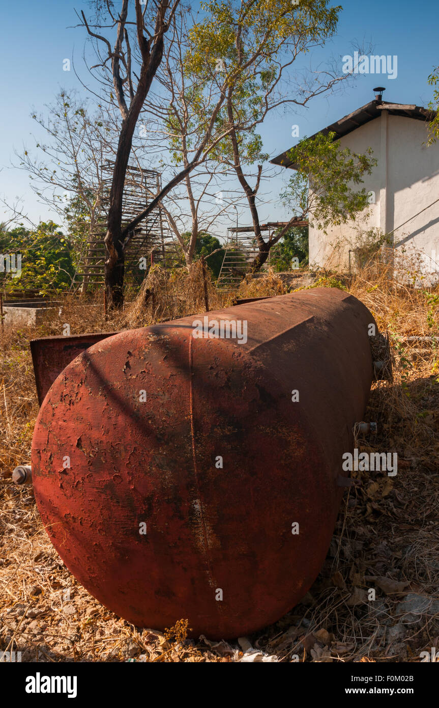 Metal waste at an abandoned sandalwood oil processing plant in Kupang, East Nusa Tenggara, Indonesia. Stock Photo
