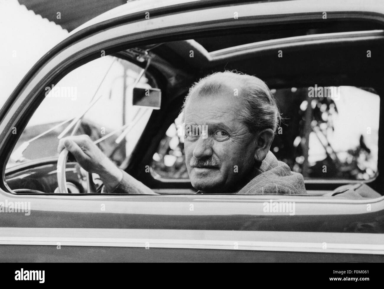 Porsche, Ferdinand, 3.9.1875 - 30.1.1951, German car design engineer and businessman, portrait, at steering wheel of a VW, circa 1950, Stock Photo