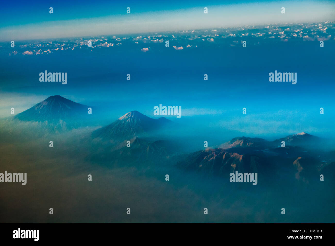 Aerial view of Mount Sumbing, Sundoro, and Dieng Plateau in Central Java, Indonesia. Stock Photo