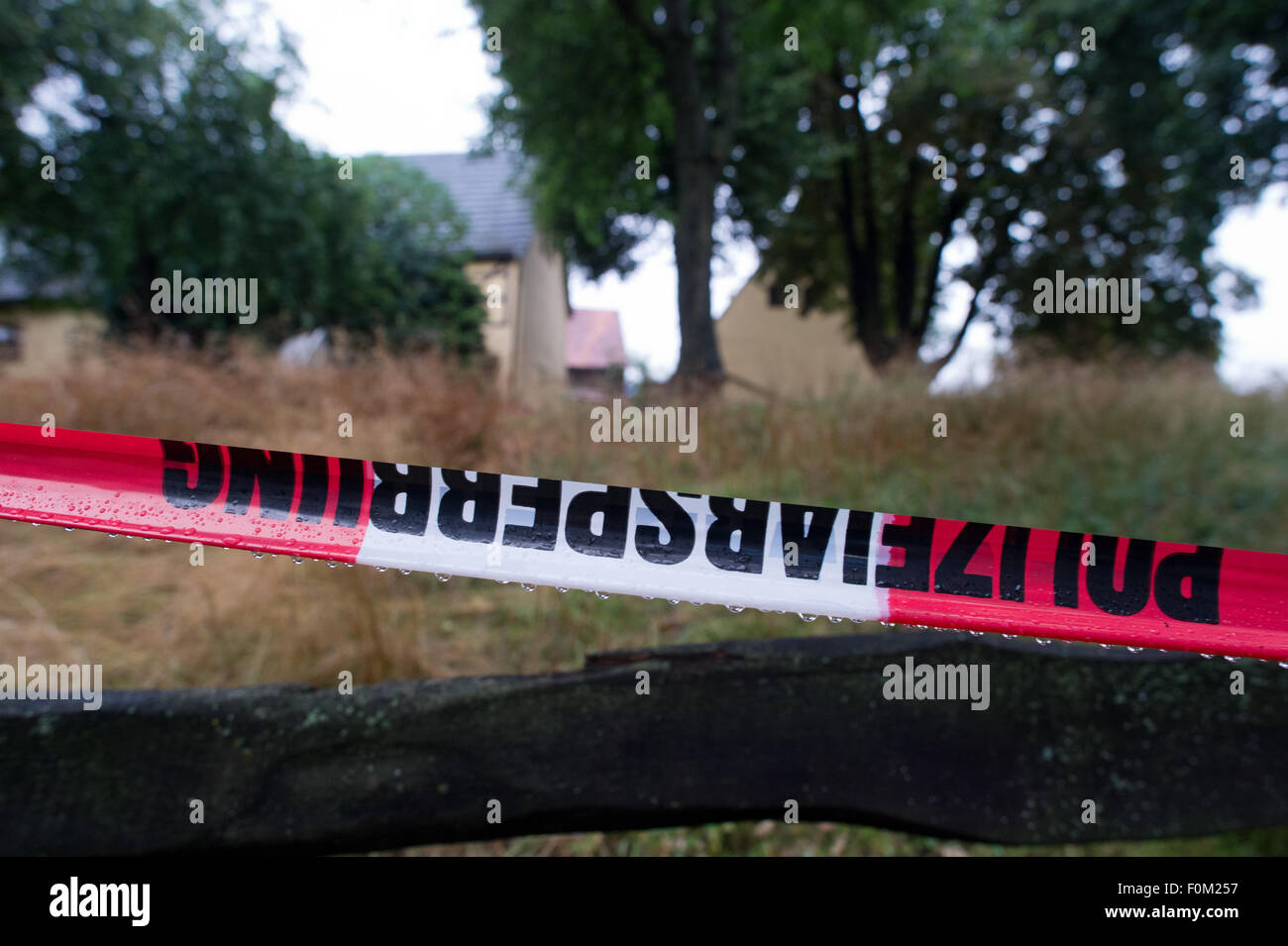 Lampersdorf, Saxony, Germany. 18th Aug, 2015. Police tape has been used to cordon off an area at a farm in Lampersdorf, Saxony, Germany, 18 August 2015. Police investigating the disappearance of 17-year-old Anneli have discovered the body of a young woman on a farm in Saxony, police said on early 18 August. The identity of the body has not yet been clarified. Police and prosecutors are due to announce more details on 18 August in a news conference. Anneli, the daughter of a wealthy German businessman, was allegedly kidnapped on 13 August 2015. Photo: Arno Burgi/dpa/Alamy Live News Stock Photo