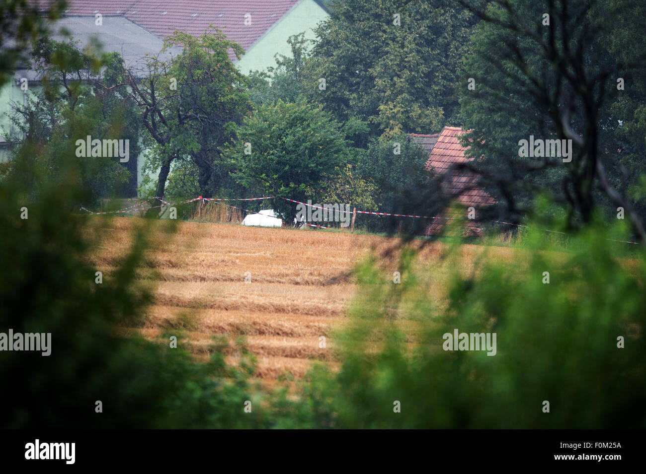 A white tent has been set up behind police tape on the grounds of a farm in Lampersdorf, Saxony, Germany, 18 August 2015. Police investigating the disappearance of 17-year-old Anneli have discovered the body of a young woman on a farm in Saxony, police said on early 18 August. The identity of the body has not yet been clarified. Police and prosecutors are due to announce more details on 18 August in a news conference. Anneli, the daughter of a wealthy German businessman, was allegedly kidnapped on 13 August 2015. Photo: Arno Burgi/dpa Stock Photo