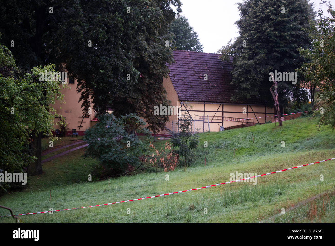 Lampersdorf, Saxony, Germany. 18th Aug, 2015. Police tape has been used to cordon off an area at a farm in Lampersdorf, Saxony, Germany, 18 August 2015. Police investigating the disappearance of 17-year-old Anneli have discovered the body of a young woman on a farm in Saxony, police said on early 18 August. The identity of the body has not yet been clarified. Police and prosecutors are due to announce more details on 18 August in a news conference. Anneli, the daughter of a wealthy German businessman, was allegedly kidnapped on 13 August 2015. Photo: Arno Burgi/dpa/Alamy Live News Stock Photo