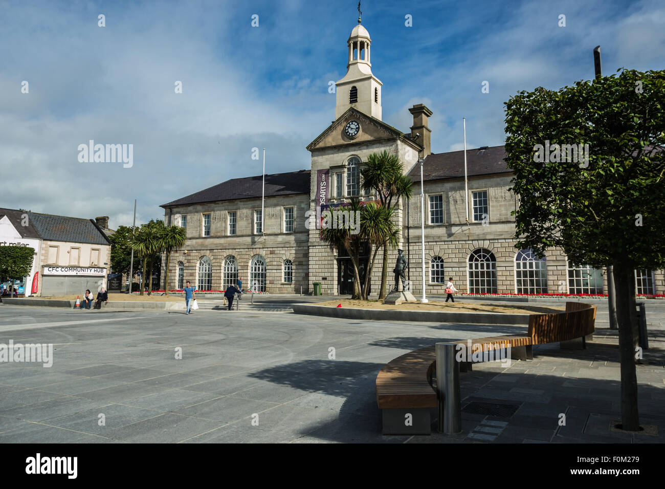 Newtownards, County Down, Northern Ireland, UK.   17th August, 2015.   Public Realm work nearing completion but still disrupting shopping and trade  Members of the public and Public Realm workers  The scheme, which is being match-funded and delivered by the Council, is intended to reinvigorate Newtownards, transforming the visual appearance of the town centre and enhancing its appeal as a place to visit and shop, generating a positive economic impact.  Work is due to be completed for Summer 2016.  Jeffrey Silvers/Alamy Live News Stock Photo