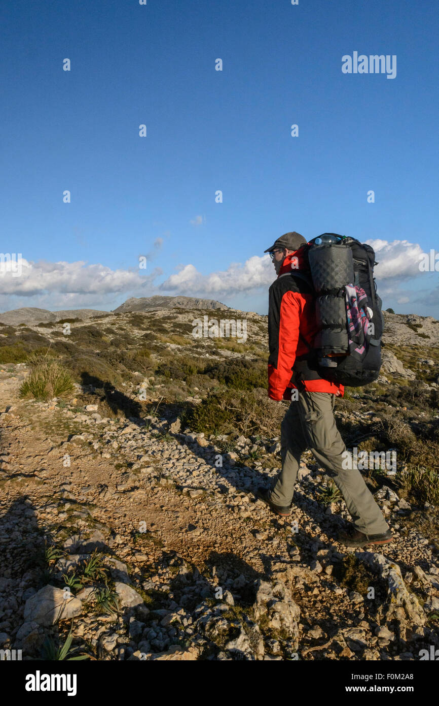 Hiker in the Tramuntana mountains, Majorca, Spain Stock Photo