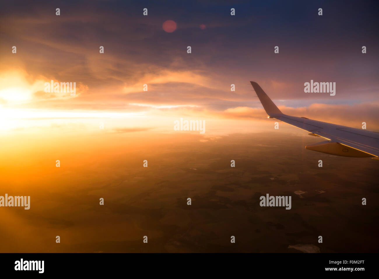 Airplane at sunrise Stock Photo