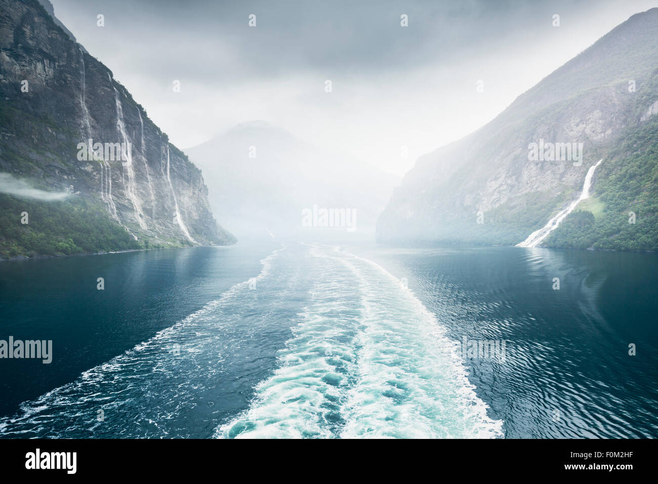 Boat in the Geirangerfjord at the waterfall 'The Seven Sisters', Norway Stock Photo
