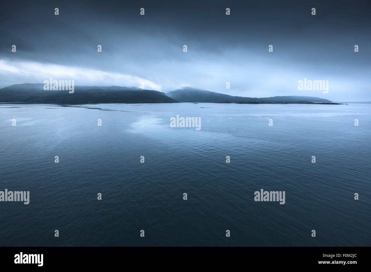 Foggy Evening Mood in the Sognefjord, Norway Stock Photo